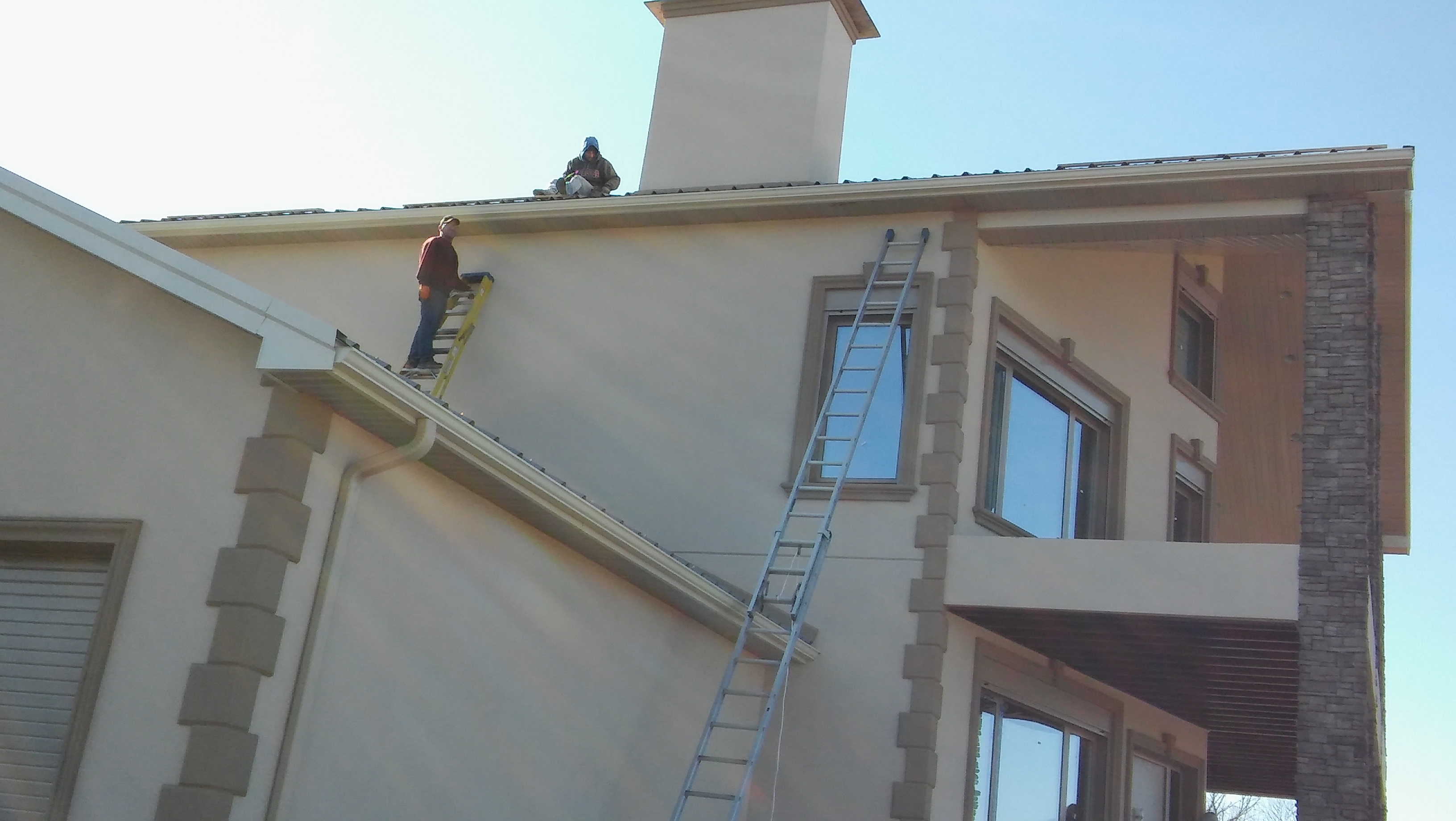 Seamless gutter installation in progress