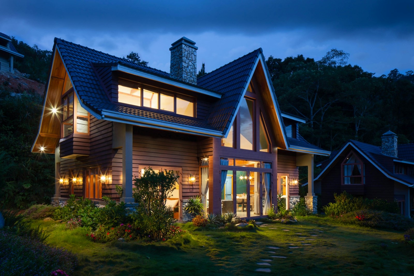 Steep-roof cottage at dusk — custom seamless copper often lands here
